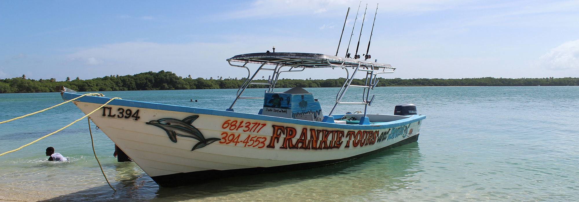 The Frankie Tours boat on turquoise water